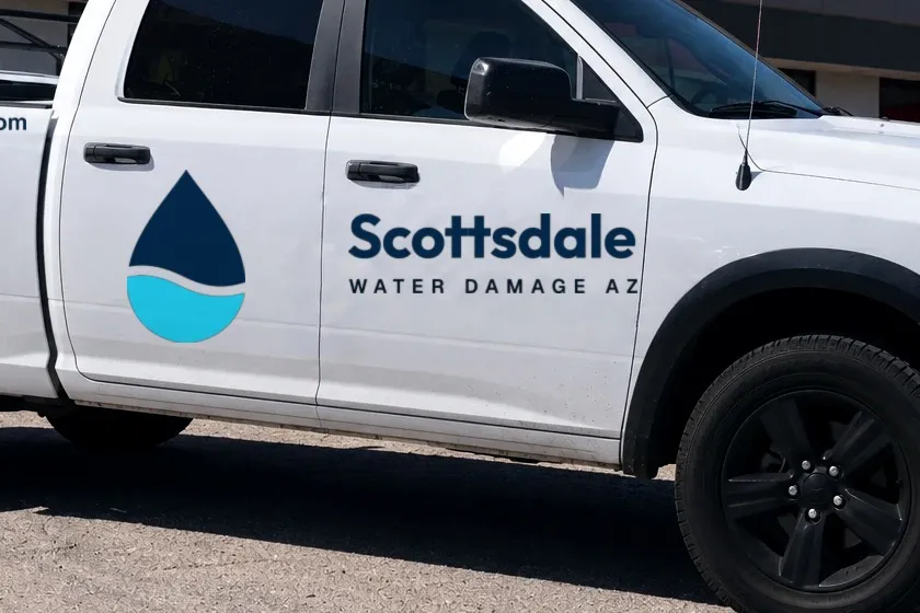 The Scottsdale Water Damage AZ logo on a pickup truck door