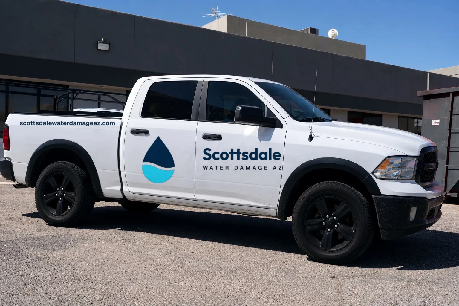 White Scottsdale Water Damage AZ pickup truck parked outside a commercial building